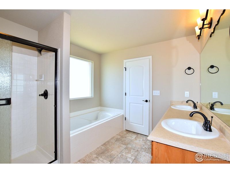Furnished interior view inside a new home in Union Colony West, Greeley (Image 15).