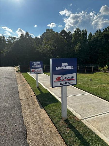Front exterior of a new home in Canterbury Villas, Carrollton, GA, highlighting curb appeal (Image 19).