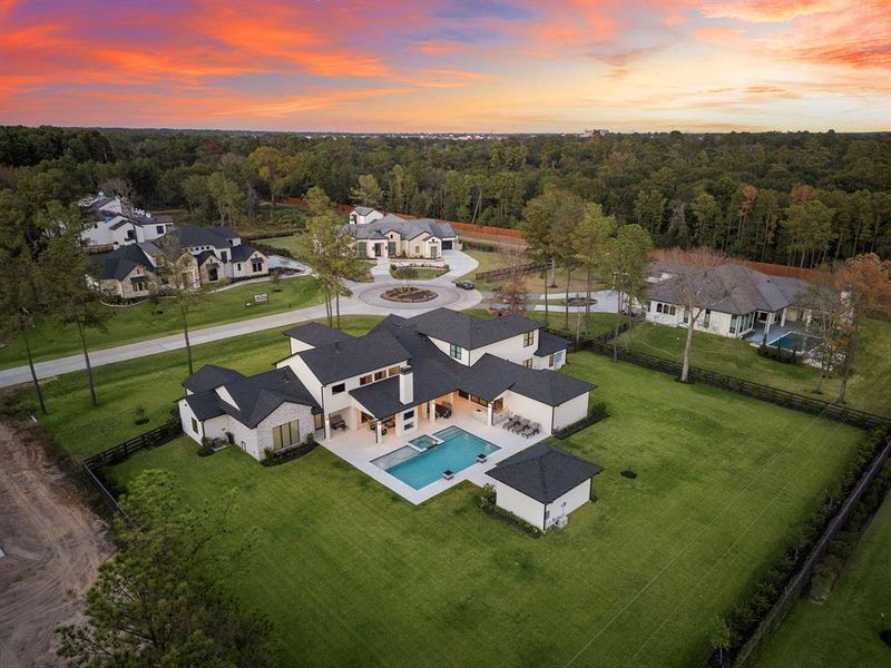 An aerial view of the property showcases the expansive 47,916 square foot (1.1 Acre) lot in highly sought after Willowcreek Ranch