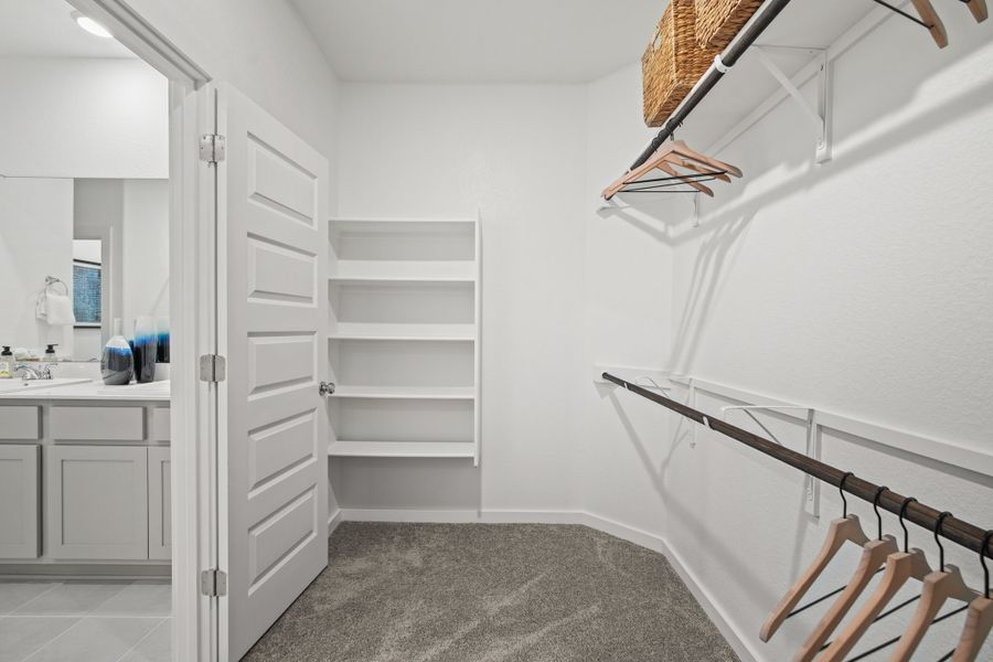 Primary Closet in the Oak home plan by Trophy Signature Homes – REPRESENTATIVE PHOTO Primary Closet in the Oak home plan by Trophy Signature Homes – REPRESENTATIVE PHOTO