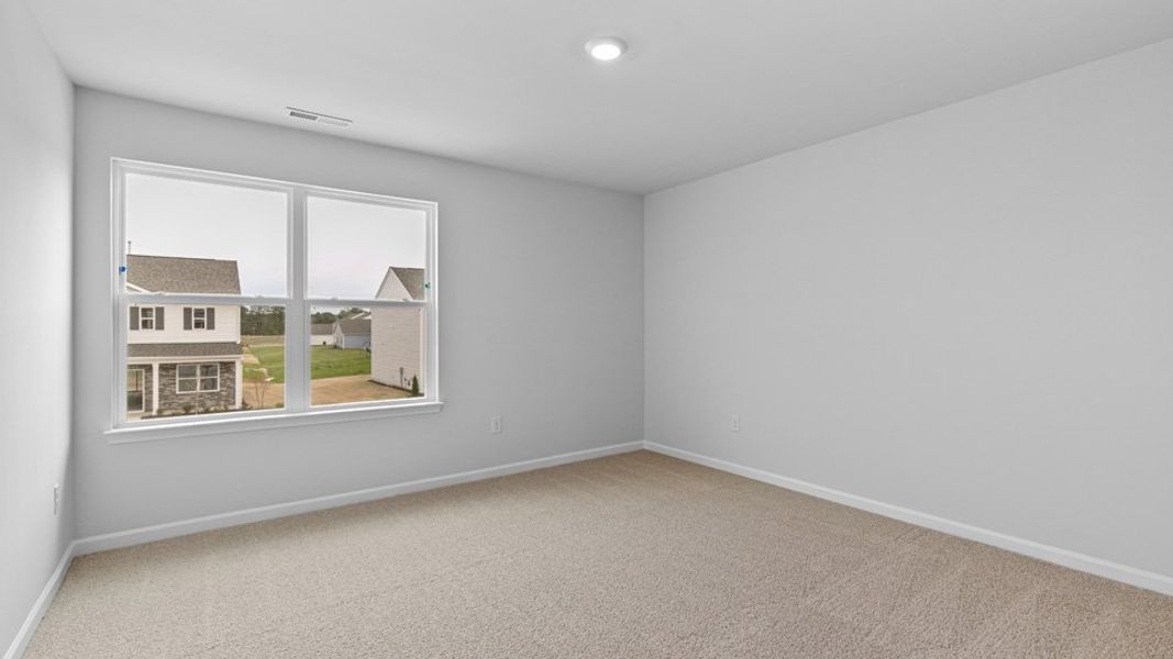 Spacious, unfurnished interior of a new home in The Reserve at Stoney Creek, Whitsett (Image 19).