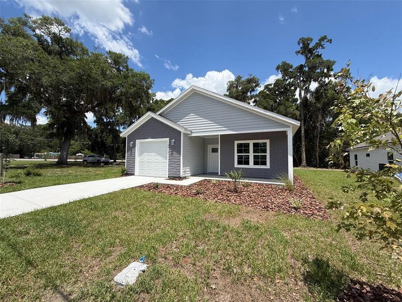 Front exterior of a new home in , Gainesville, FL, highlighting curb appeal (Image 1). Front exterior of a new home in , Gainesville, FL, highlighting curb appeal (Image 1).