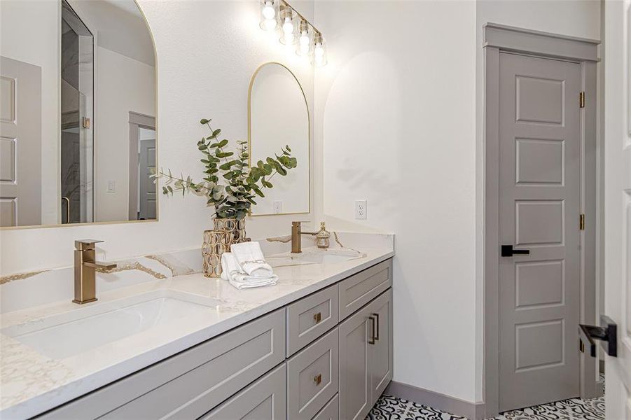 Bathroom featuring double vanity