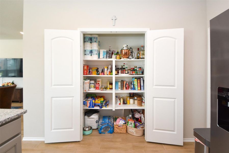 Look at this amazing and spacious pantry located in the kitchen. Lots of shelves and storage space available and so convenient to the kitchen. Look at this amazing and spacious pantry located in the kitchen. Lots of shelves and storage space available and so convenient to the kitchen.