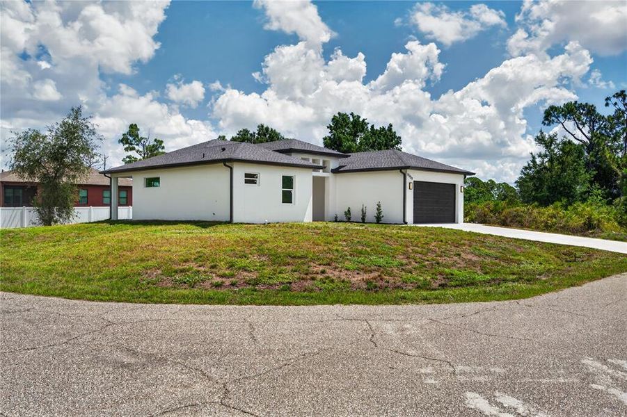Front exterior of a new home in , Port Charlotte, FL, highlighting curb appeal (Image 26). Front exterior of a new home in , Port Charlotte, FL, highlighting curb appeal (Image 26).