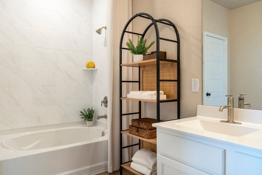 Garden tub with tile surround at primary bath Garden tub with tile surround at primary bath