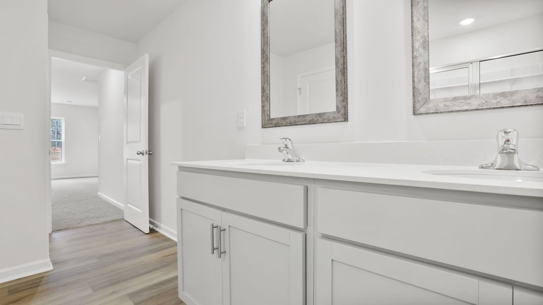 Furnished interior view inside a new home in Bentley Park, Greenwood (Image 8).