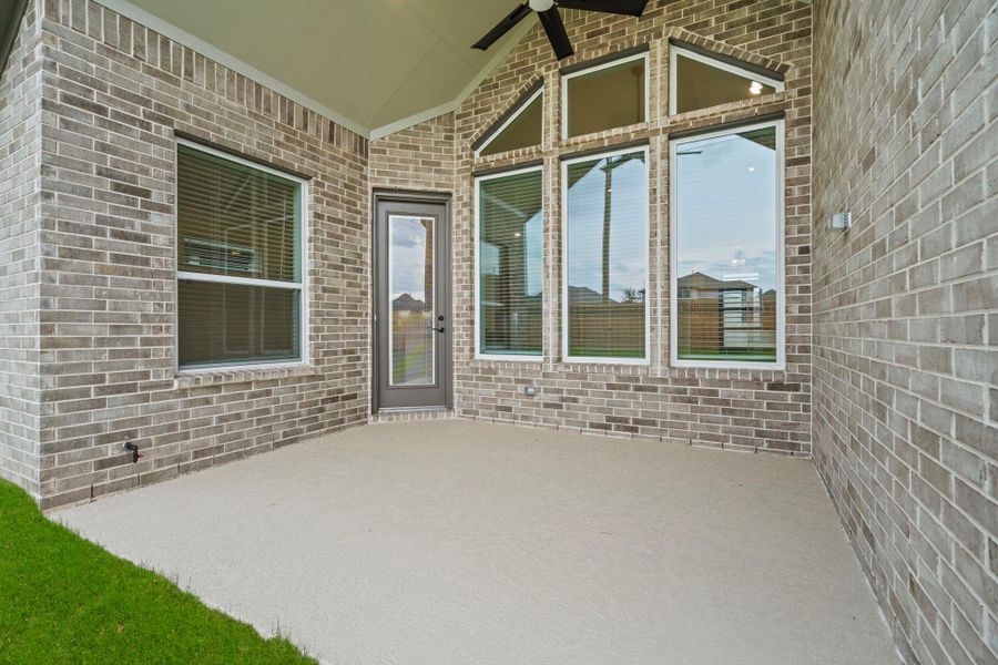 Exterior details and patio area of a home in Elyson 60's, Katy (Image 3).