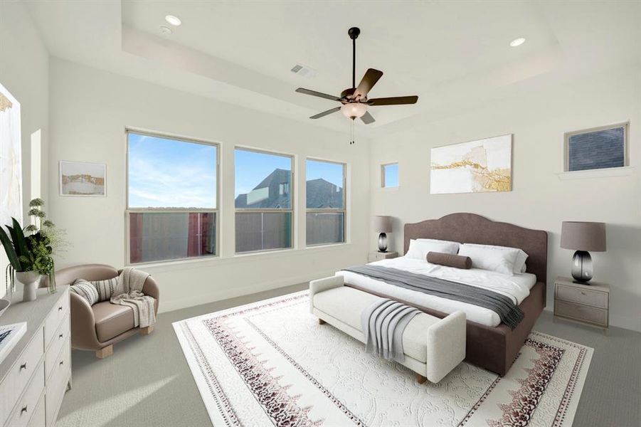 Carpeted bedroom with a tray ceiling, ceiling fan, and recessed lighting Carpeted bedroom with a tray ceiling, ceiling fan, and recessed lighting