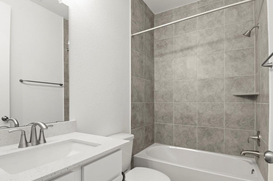 Bathroom featuring vanity and shower / tub combination