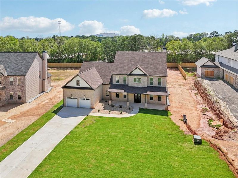 Front exterior of a new home in , Lilburn, GA, highlighting curb appeal (Image 34).