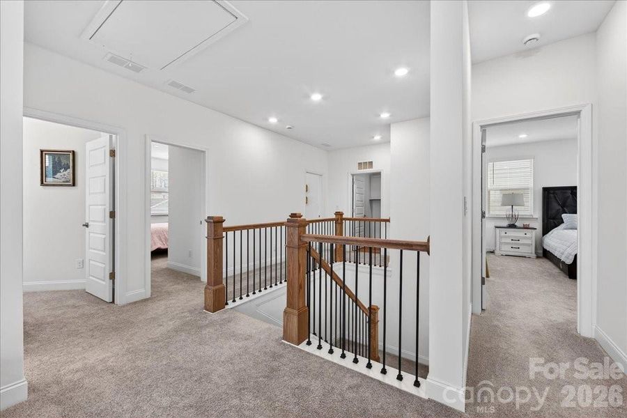 View of the upstairs level which includes 9' ceilings as well.