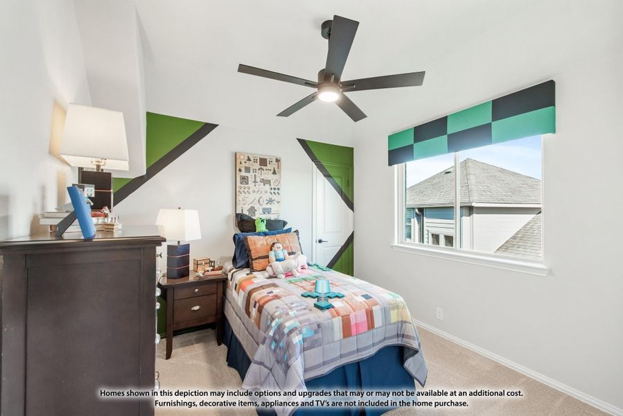 Children's bedroom with green geometric wall design, ceiling fan, twin bed, and dark wood dresser