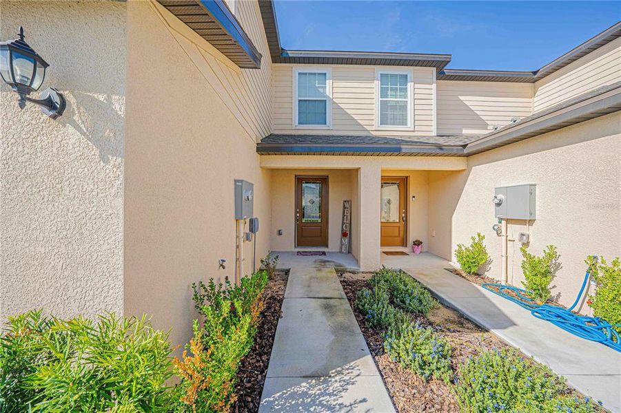 Front exterior of a new home in Hamlets of Tavares, Tavares, FL, highlighting curb appeal (Image 24). Front exterior of a new home in Hamlets of Tavares, Tavares, FL, highlighting curb appeal (Image 24).