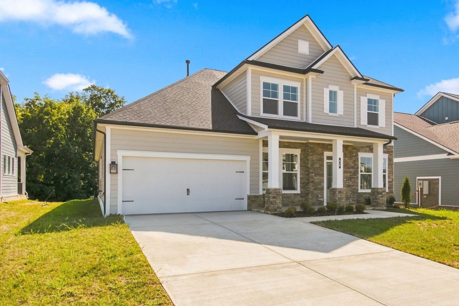 Front exterior of a new home in Heritage Green – The Signature Collection, Columbia, TN, highlighting curb appeal (Image 21). Front exterior of a new home in Heritage Green – The Signature Collection, Columbia, TN, highlighting curb appeal (Image 21).