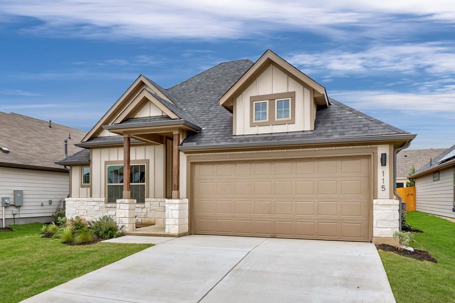 Front exterior of a new home in Prairie Winds, Hutto, TX, highlighting curb appeal (Image 19).