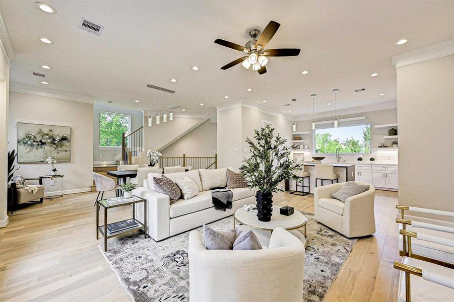 Open and bright, the main living area is filled with natural light and sits underneath high ceilings.