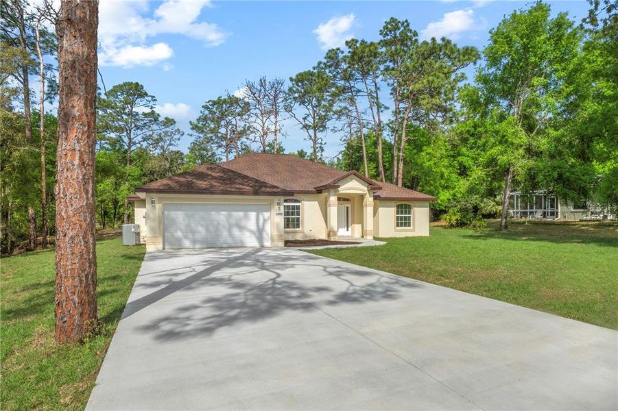 Front exterior of a new home in , Dunnellon, FL, highlighting curb appeal (Image 25).