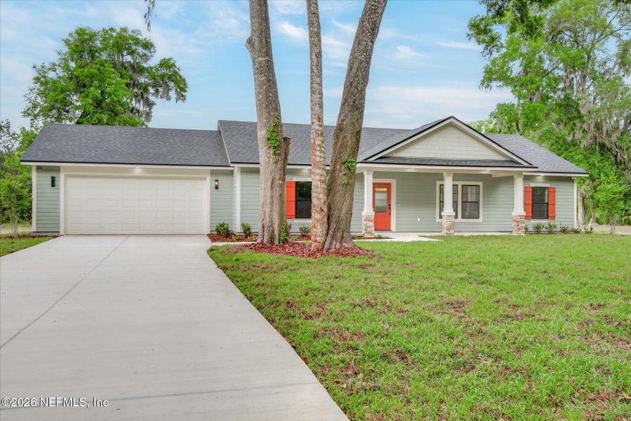 Front exterior of a new home in , San Mateo, FL, highlighting curb appeal (Image 19).