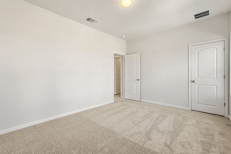 Representative unfurnished interior of a home built from the Somerville by Ashton Woods in Willow Springs, Buda (Image 39).