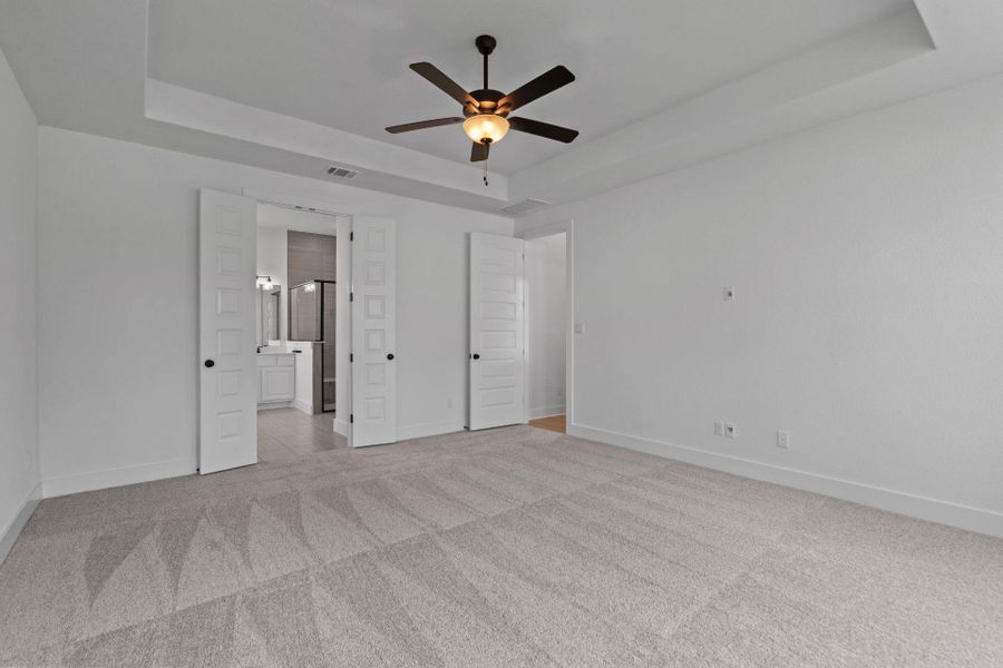 Primary Bedroom with tray ceiling
