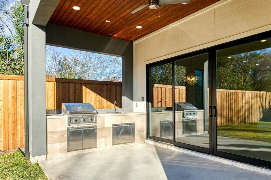 View of patio / terrace featuring area for grilling, ceiling fan, and sink