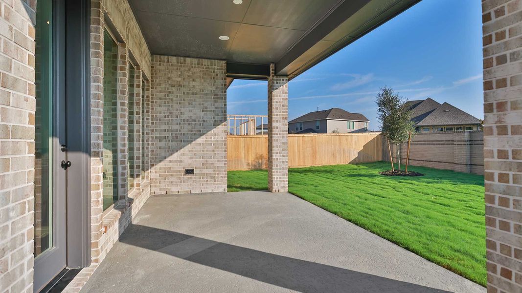 Exterior details and patio area of a home in Bridgeland, Cypress (Image 3). Exterior details and patio area of a home in Bridgeland, Cypress (Image 3).