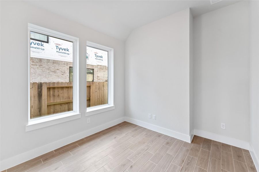 Spacious, unfurnished interior of a new home in Ellwood, Iowa Colony (Image 20).