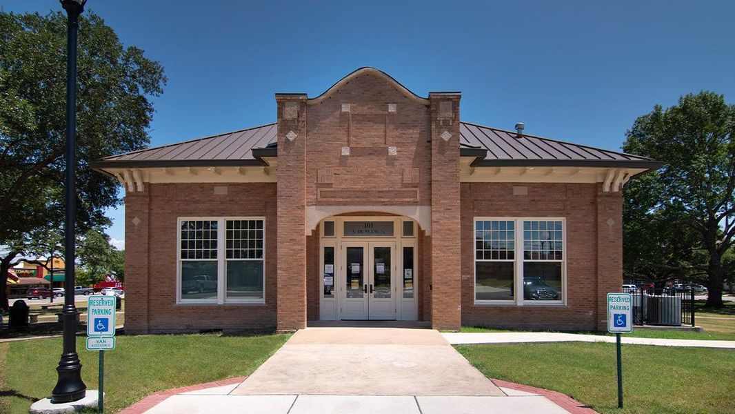 Front exterior of a new home in Paramount, Kyle, TX, highlighting curb appeal (Image 15).