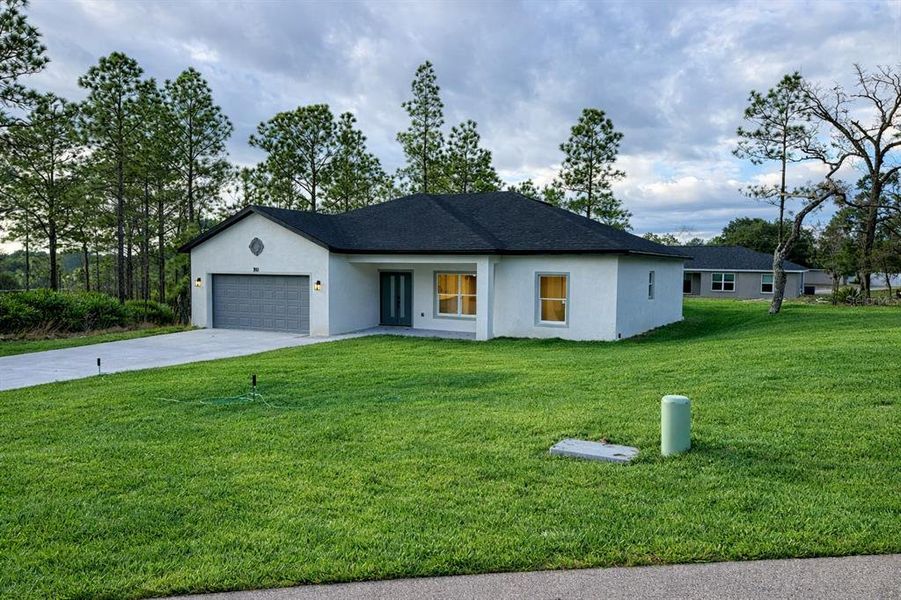 Front exterior of a new home in , Citrus Springs, FL, highlighting curb appeal (Image 2). Front exterior of a new home in , Citrus Springs, FL, highlighting curb appeal (Image 2).