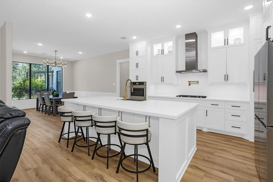 Chef’s kitchen with oversized island and seating