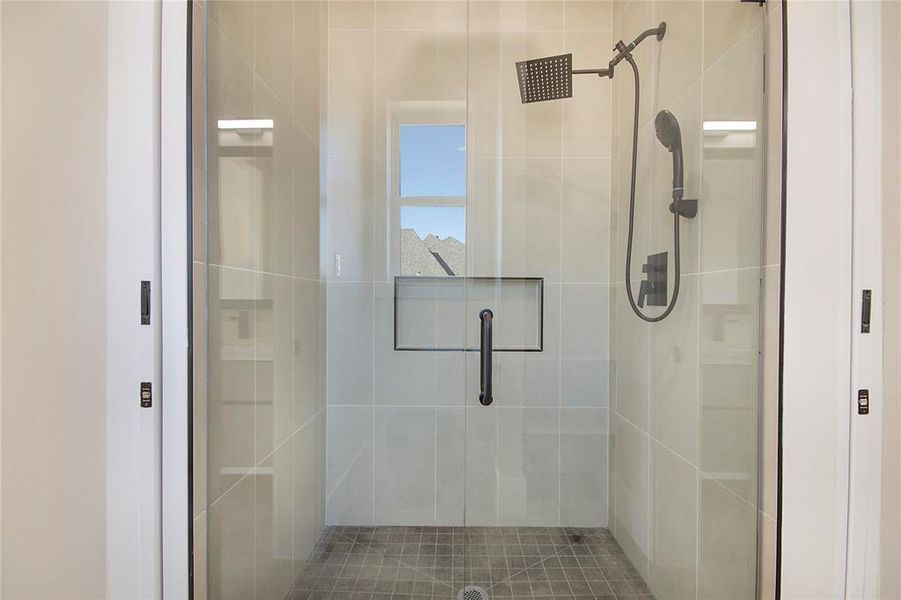 Full bathroom featuring a stall shower Full bathroom featuring a stall shower
