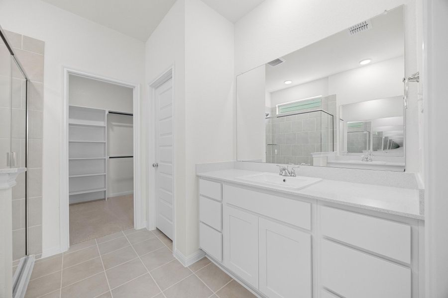 Primary Bath in the Magnolia home plan by Trophy Signature Homes – REPRESENTATIVE PHOTO