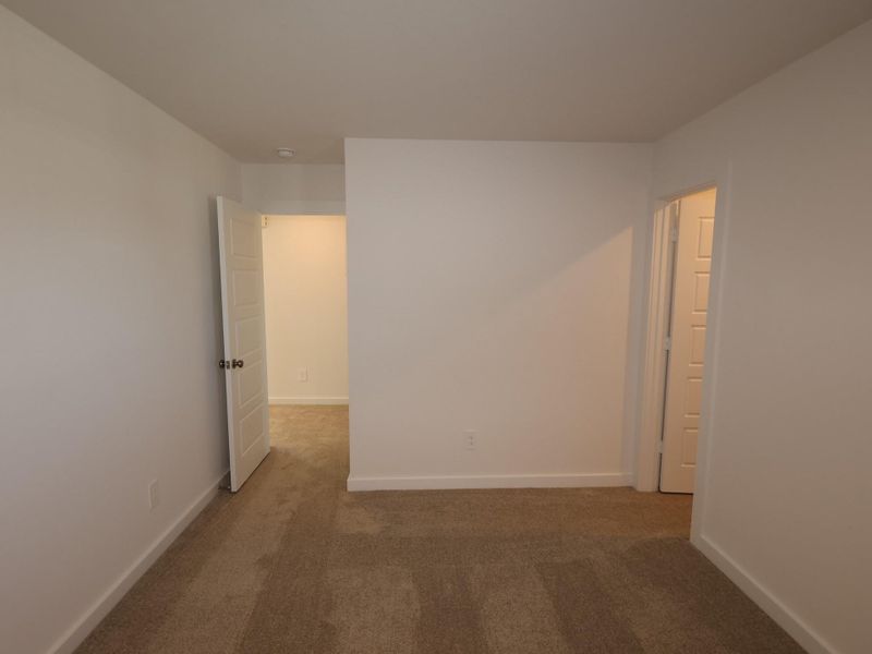 Spacious, unfurnished interior of a new home in Pinewood at Grand Texas, New Caney (Image 19).