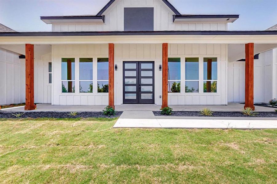 Property entrance featuring a yard