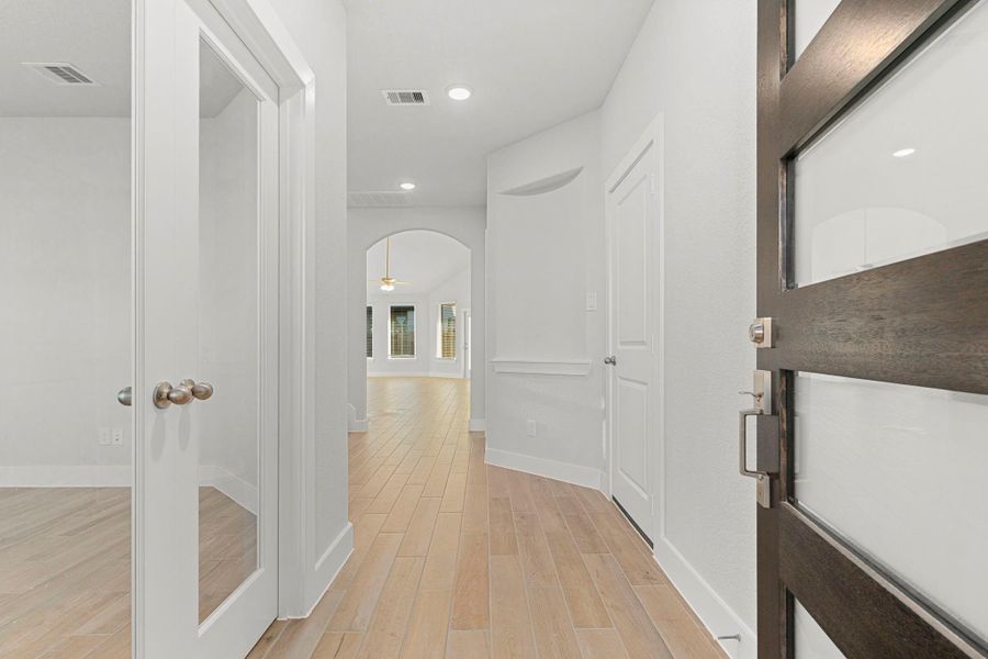 Inside, the entryway greets you with high ceilings, soft natural light, and sleek wood-like tile floors that flow seamlessly toward the open living areas. A sense of spaciousness and warmth sets the tone for what’s to come. Inside, the entryway greets you with high ceilings, soft natural light, and sleek wood-like tile floors that flow seamlessly toward the open living areas. A sense of spaciousness and warmth sets the tone for what’s to come.