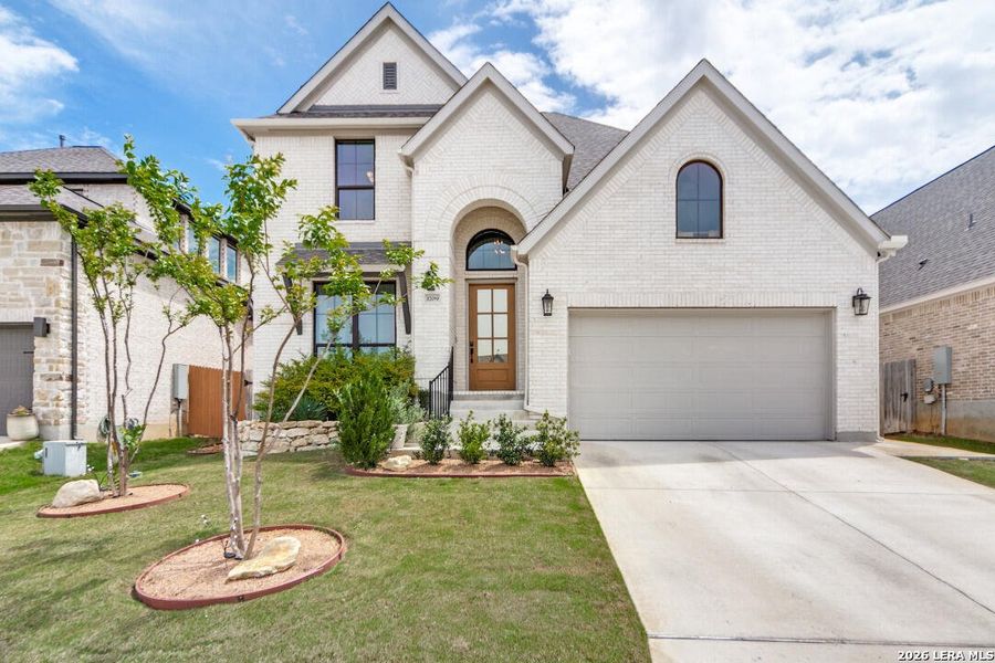 Front exterior of a new home in Ventana Park, Bulverde, TX, highlighting curb appeal (Image 2). Front exterior of a new home in Ventana Park, Bulverde, TX, highlighting curb appeal (Image 2).
