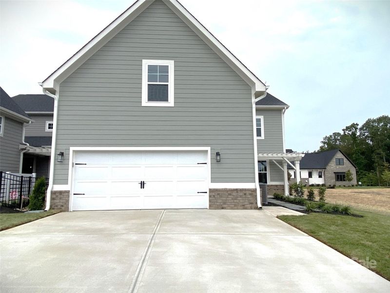 Front exterior of a new home in , Davidson, NC, highlighting curb appeal (Image 17).
