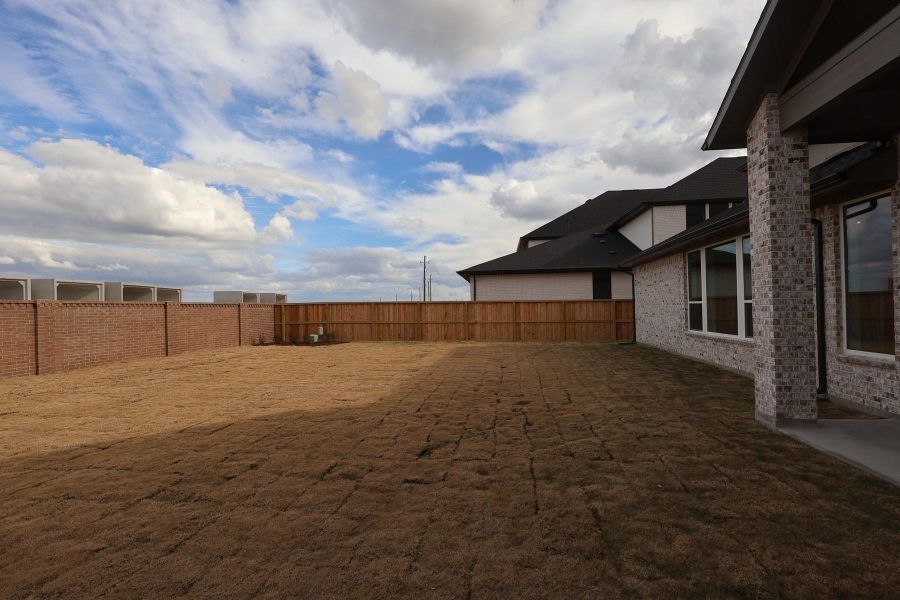 Exterior details and patio area of a home in Dunham Pointe, Cypress (Image 3).