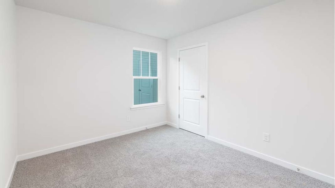 Spacious, unfurnished interior of a new home in Reedy Creek Preserve, Charlotte (Image 20).