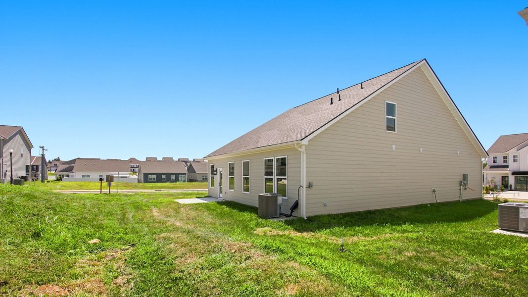 Rear of Home with concrete patio, Backyard, and large side yard
