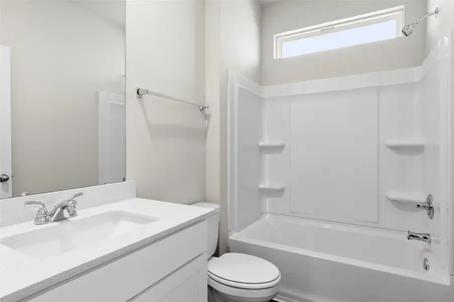 Bathroom featuring vanity and shower / bathtub combination