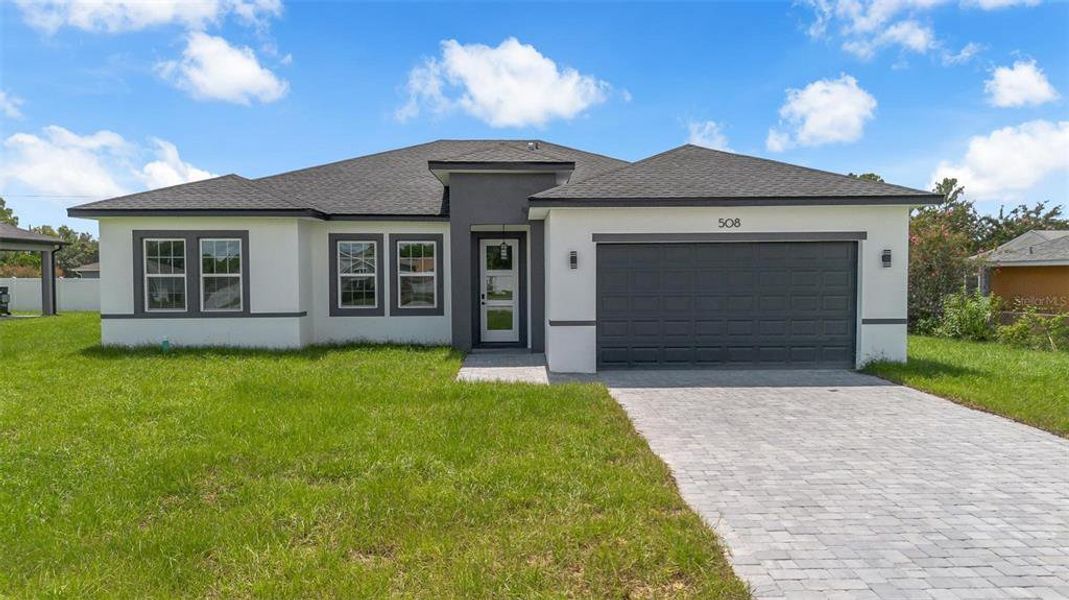 Front exterior of a new home in , Ocala, FL, highlighting curb appeal (Image 23).