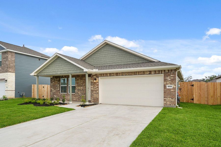 Front exterior of a new home in Valor Park, Bay City, TX, highlighting curb appeal (Image 2). Front exterior of a new home in Valor Park, Bay City, TX, highlighting curb appeal (Image 2).