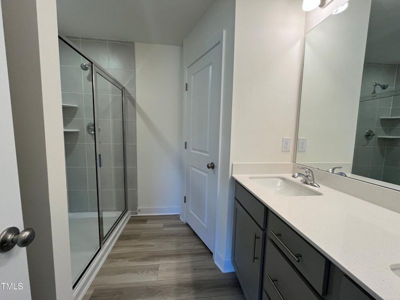 Primary walk in tiled shower