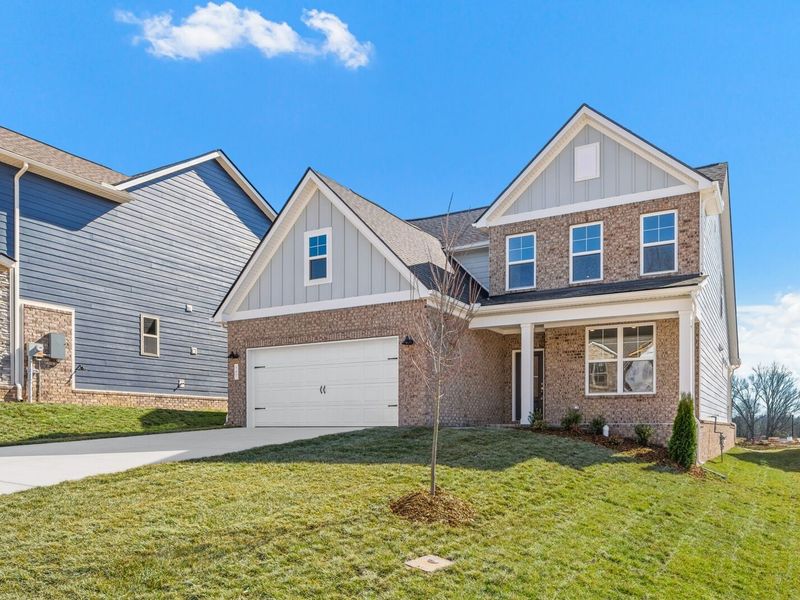 Front exterior of a new home in Woods Crossing, Gallatin, TN, highlighting curb appeal (Image 28).
