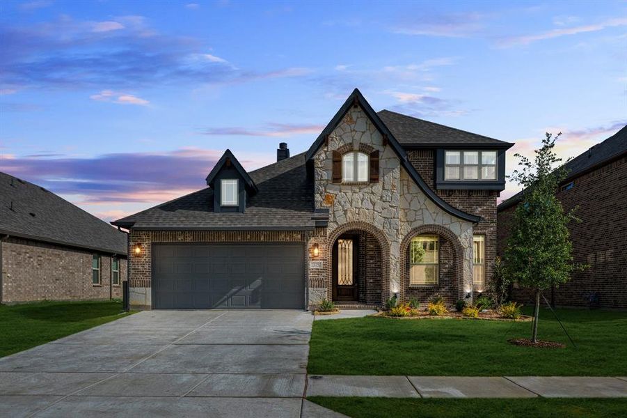 Front exterior of a new home in Woodstone, Providence Village, TX, highlighting curb appeal (Image 2).
