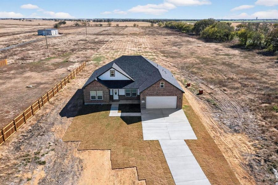 Front exterior of a new home in , Alma, TX, highlighting curb appeal (Image 18).