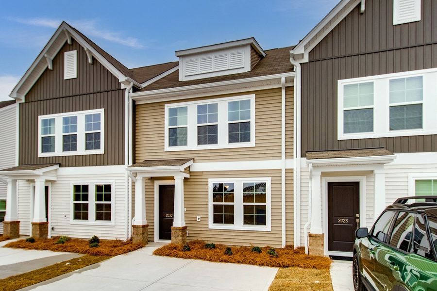 Front exterior of a new home in Astoria, Columbia, SC, highlighting curb appeal (Image 18). Front exterior of a new home in Astoria, Columbia, SC, highlighting curb appeal (Image 18).