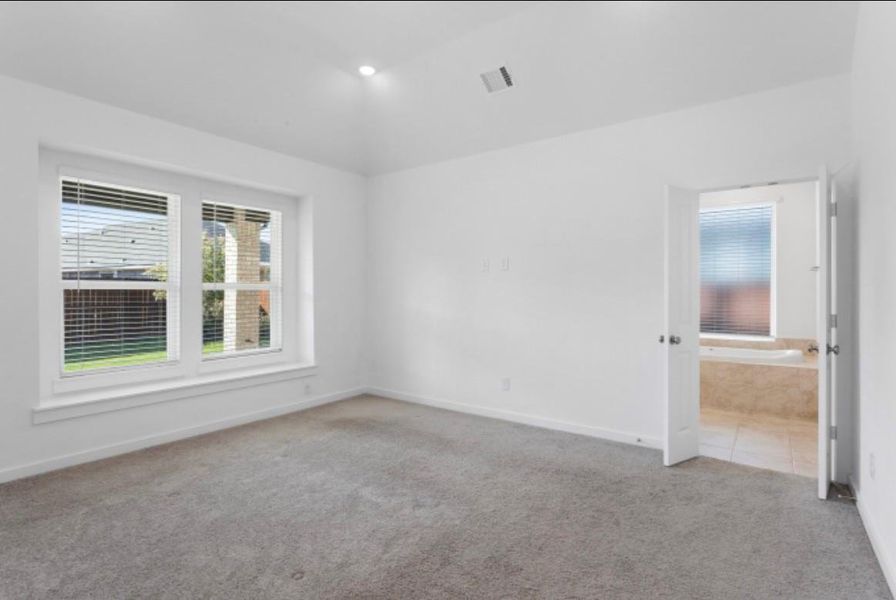 Spacious master bedroom with plenty of natural light and peaceful retreat feel with blinds included. Spacious master bedroom with plenty of natural light and peaceful retreat feel with blinds included.